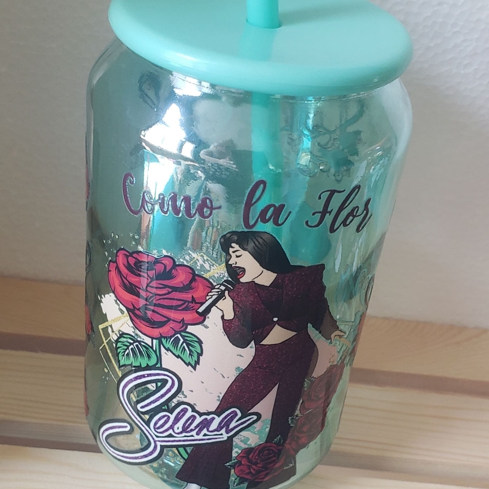 Handcrafted Selena glass mug with plastic top and straw.